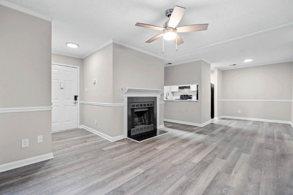 living room with a fireplace and ceiling fan  at Henley, North Carolina, 28311