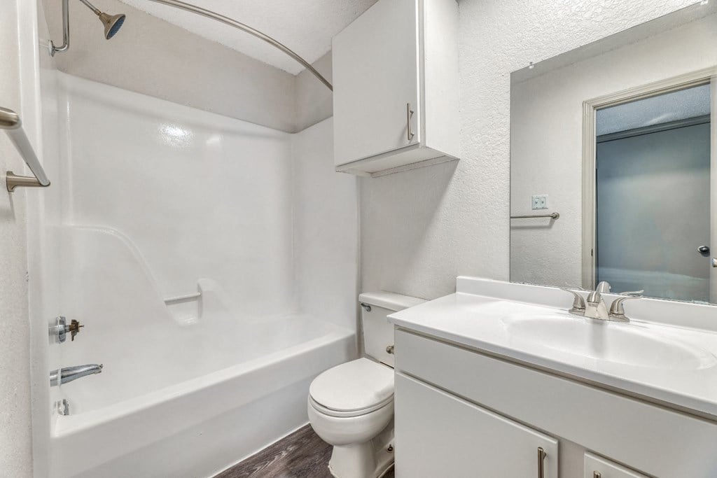 a bathroom with a sink toilet and a shower