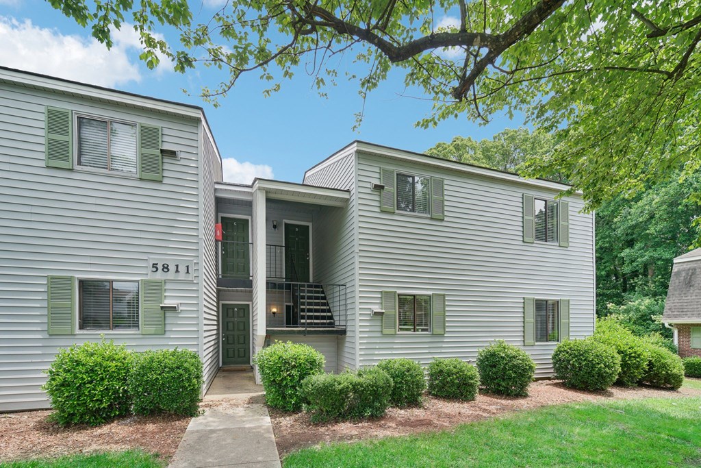 exterior view of the apartments with lawns and trees