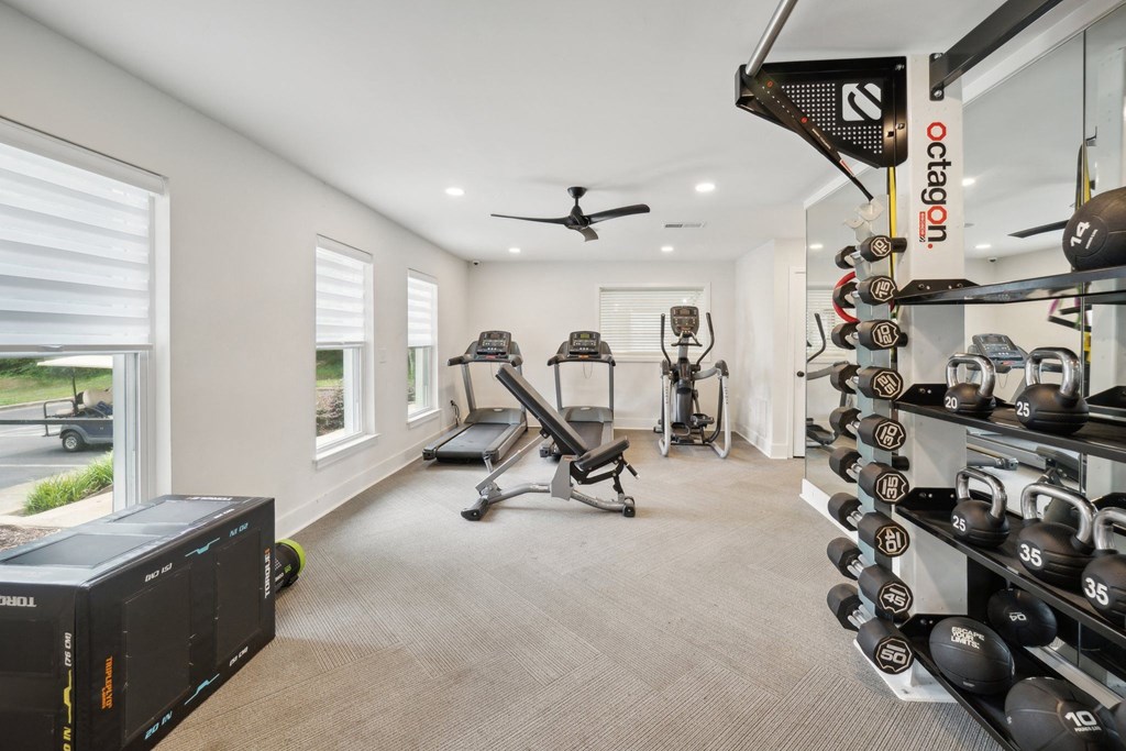 the gym with treadmills and weights at the preserve at greatstone