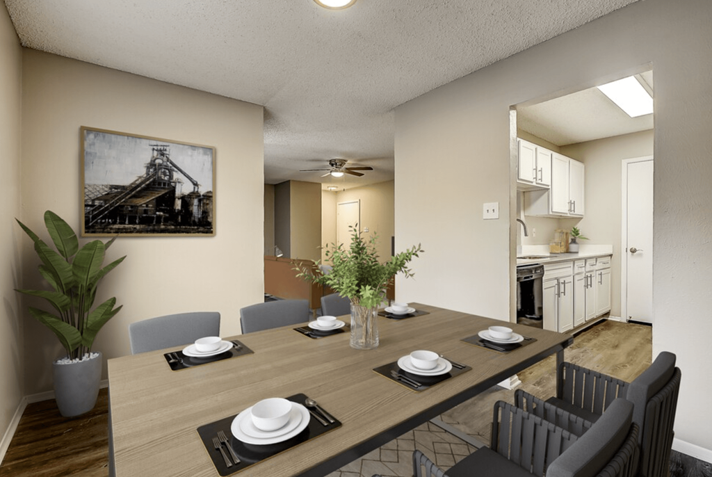 an open dining room and kitchen with a table and chairs