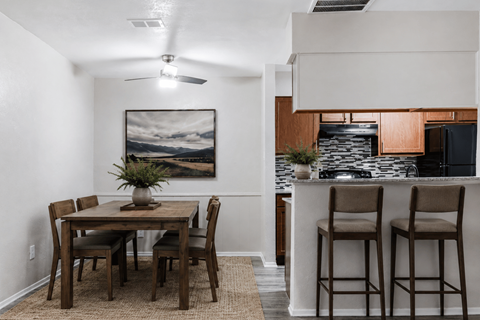 Dining area with breakfast bar and modern kitchen at Ridgeview Apartments, Texas
