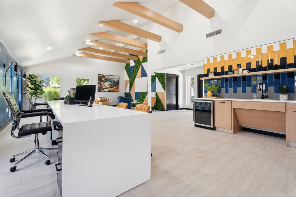 A modern office with a white reception desk and a black office chair. at Anson at North Hills, North Carolina, 27604
