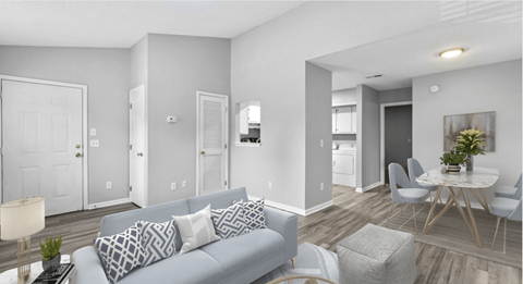 a living room and dining room with a couch and a table