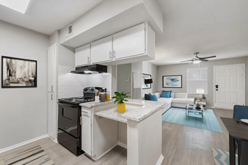 a kitchen and living room with a counter top at Anson at North Hills, Raleigh, 27604