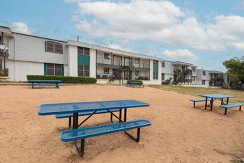 our apartments have a picnic area with benches and tables