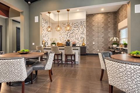 Community dining room with bar and pendant lights at Echelon at Monterrey Village Apartments, Texas, 78245
