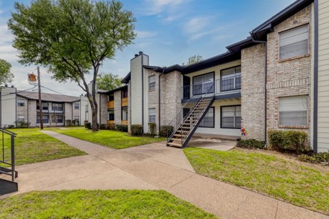 Residential building exterior with private balcony access at Marshall Apartments, Balch Springs