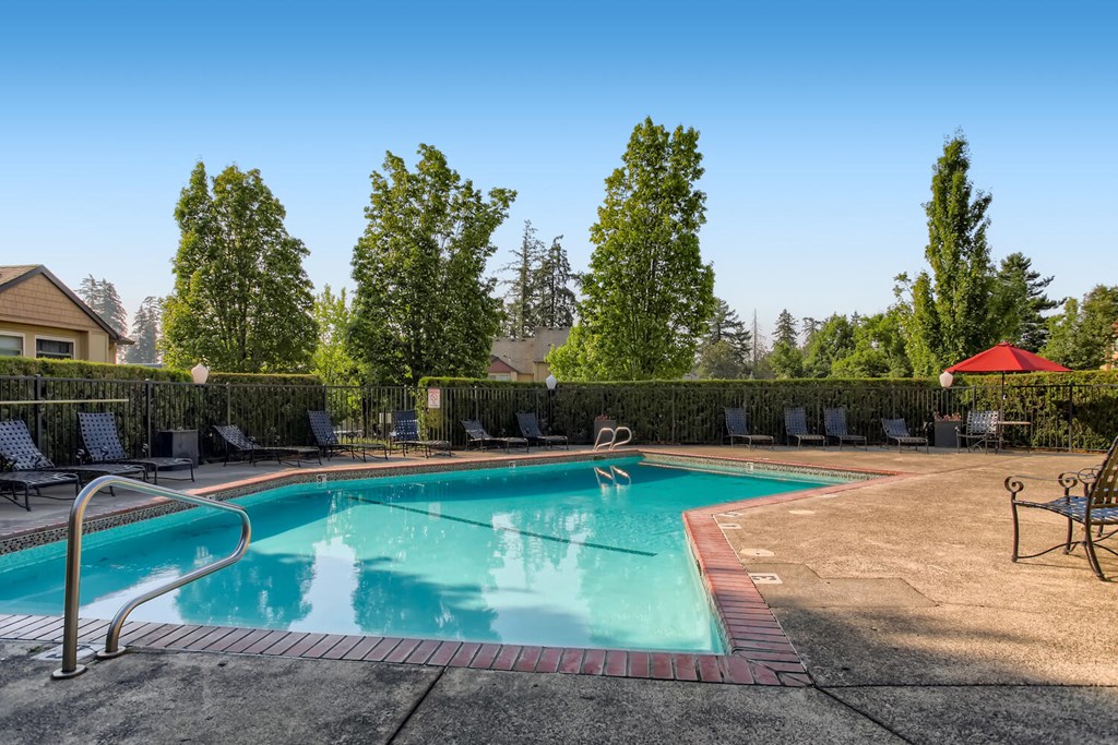One-BR Apartments In Happy Valley, OR - Sunnyside Village - Glistening Pool With Lounge Chairs