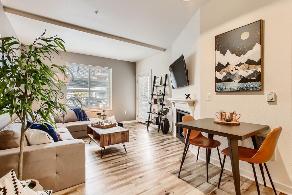 a living room and dining room with a couch and a table