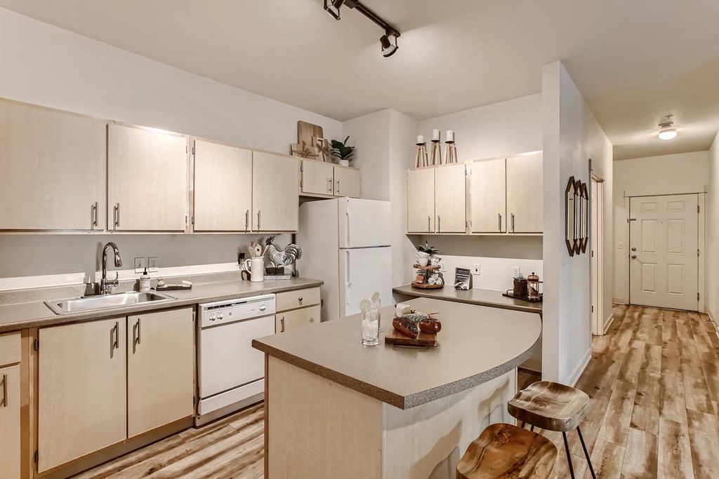 Apartments for Rent in Fairview - Fully Equipped Well Lit Kitchen with Wood Flooring and Island.