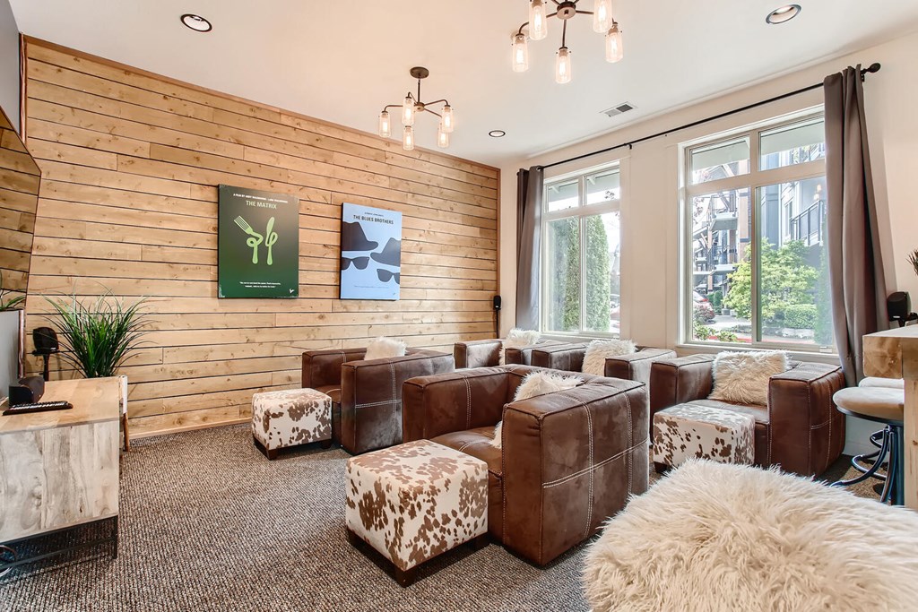 a living room with couches and chairs and a large window