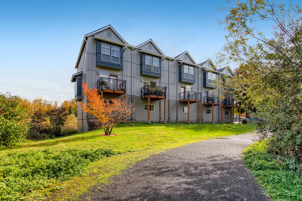 a path leading up to a building with trees