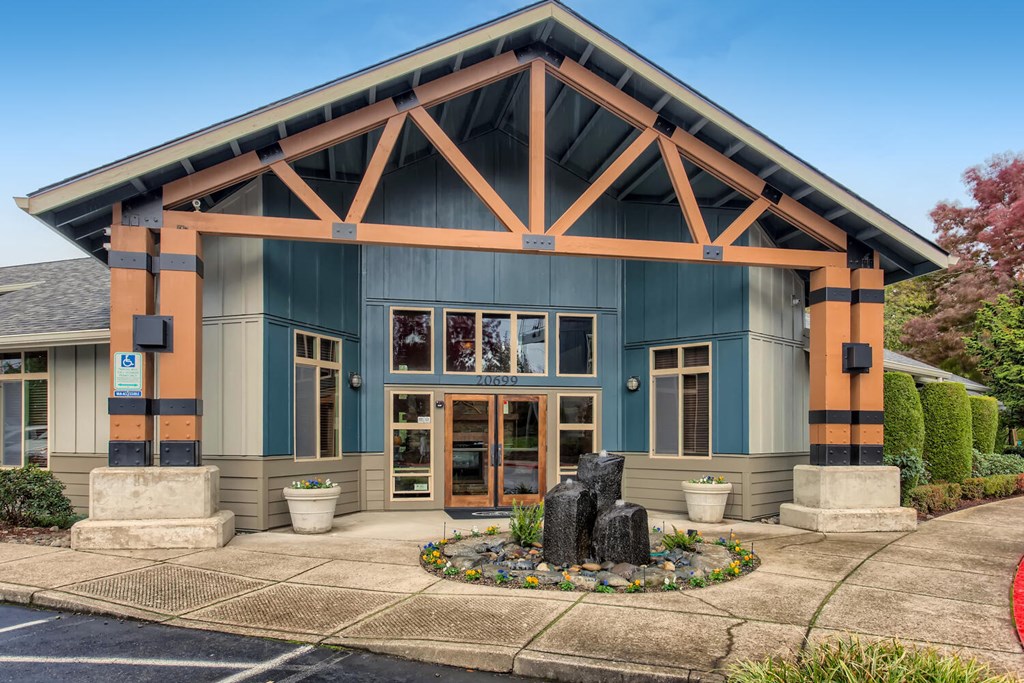 the front of a building with a statue in front of it