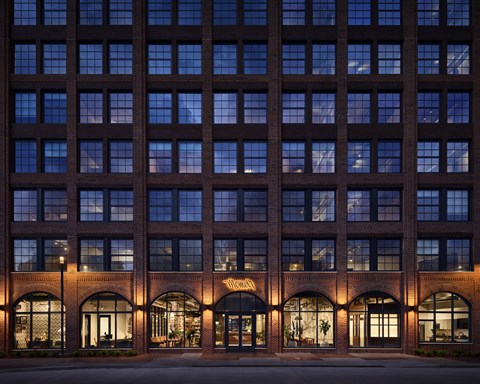 a view of the facade of a building at night