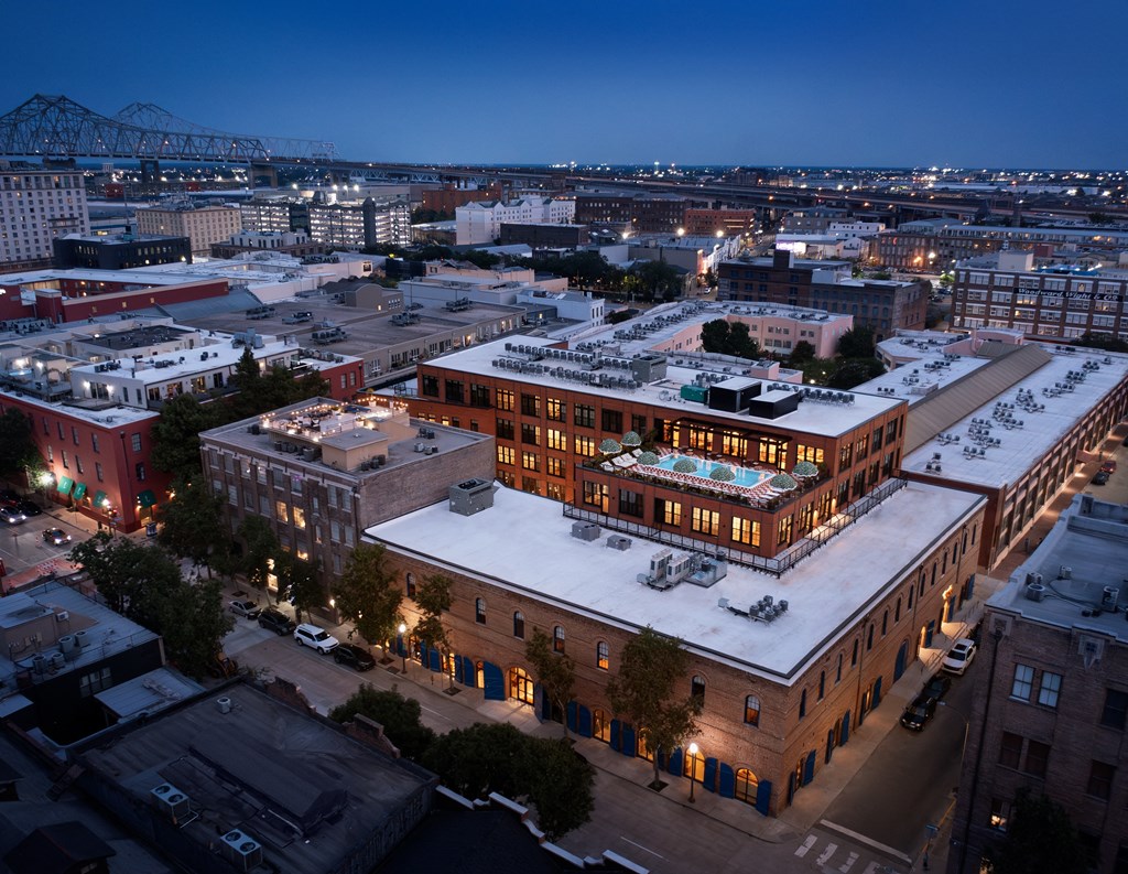 an aerial view of a building in a city at night