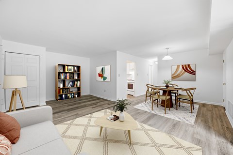A living room with a grey couch and a coffee table.