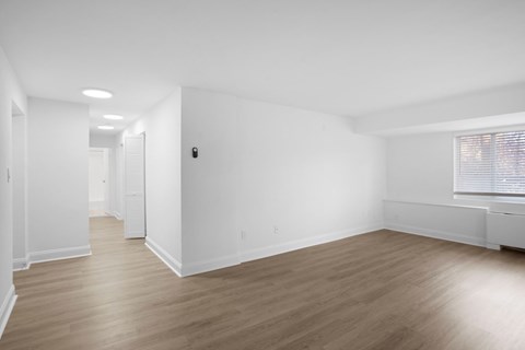 Living and dining room  with vinyl plank flooring.