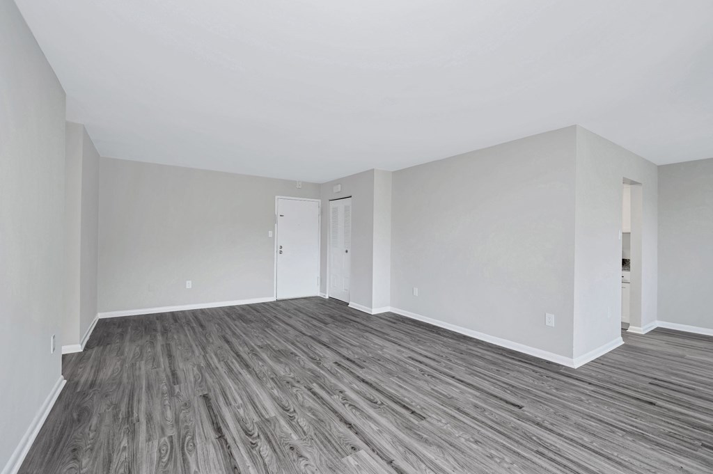 Renovated living dining area. Grey plank flooring.
