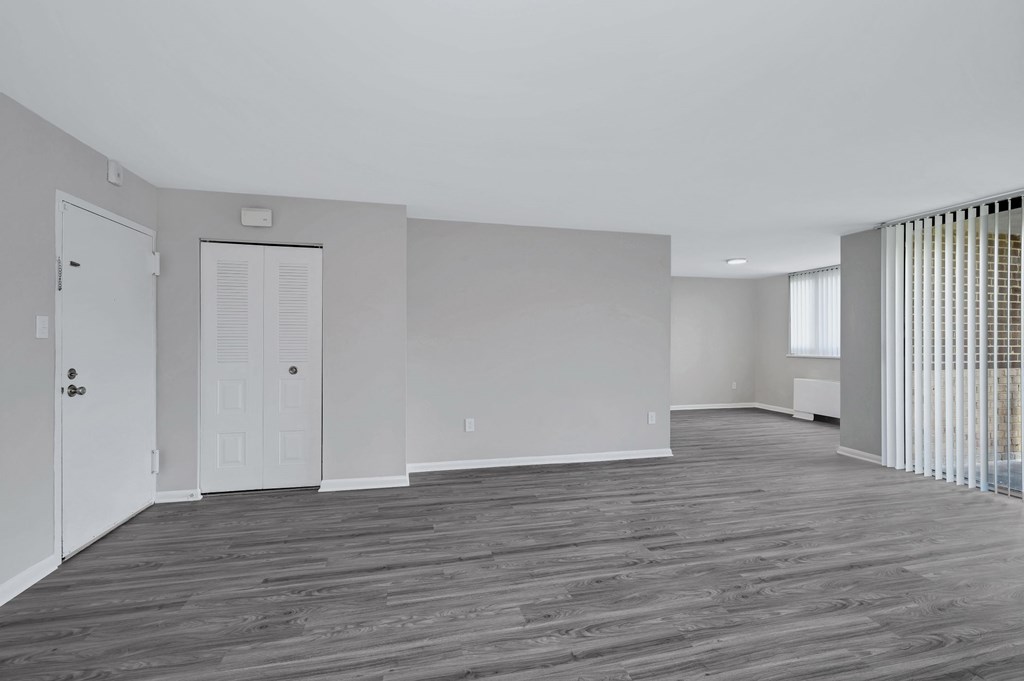 Renovated living dining area. Grey plank flooring.