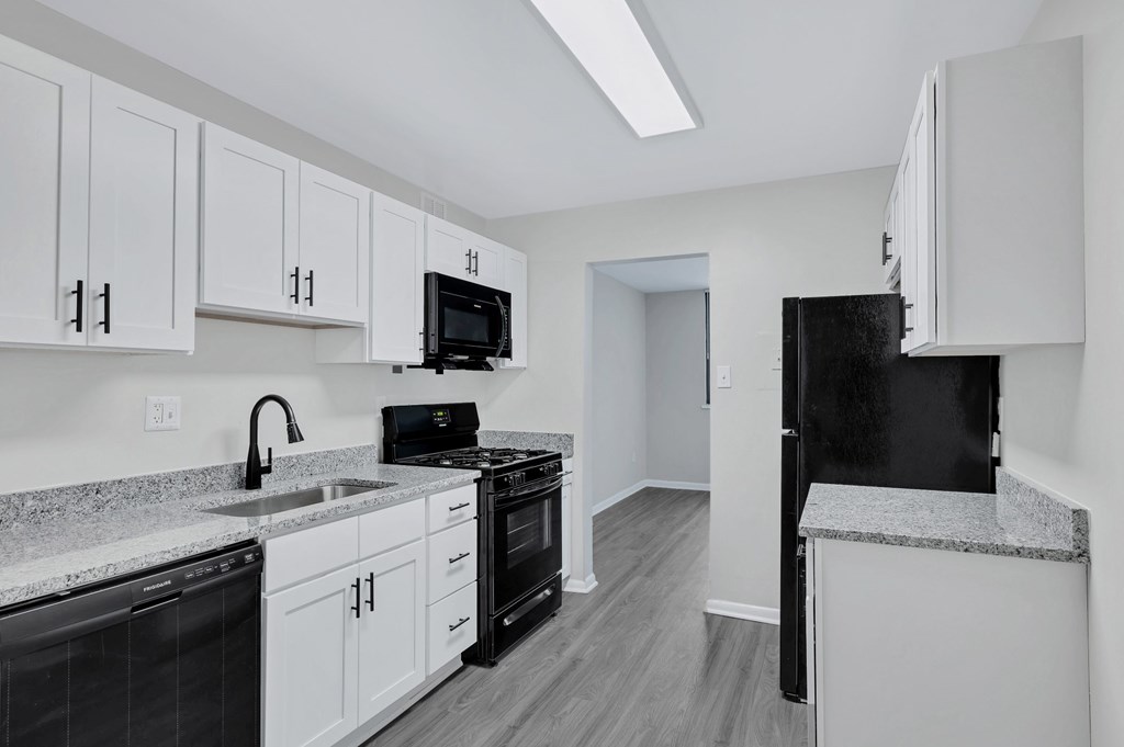 Renovated kitchen with white cabinets