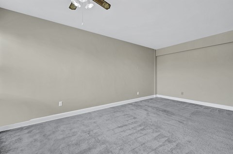 Apartment home interior with wall-to-wall carpeting