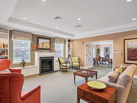 a living room with a couch and a fireplace