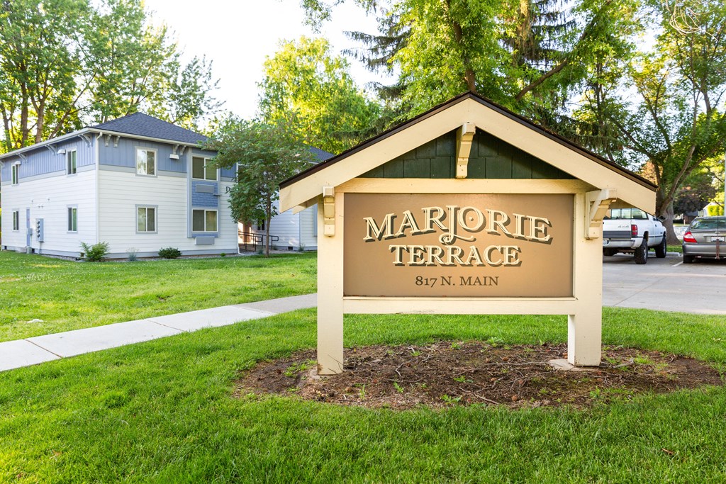 a sign formarore terrace in front of a house