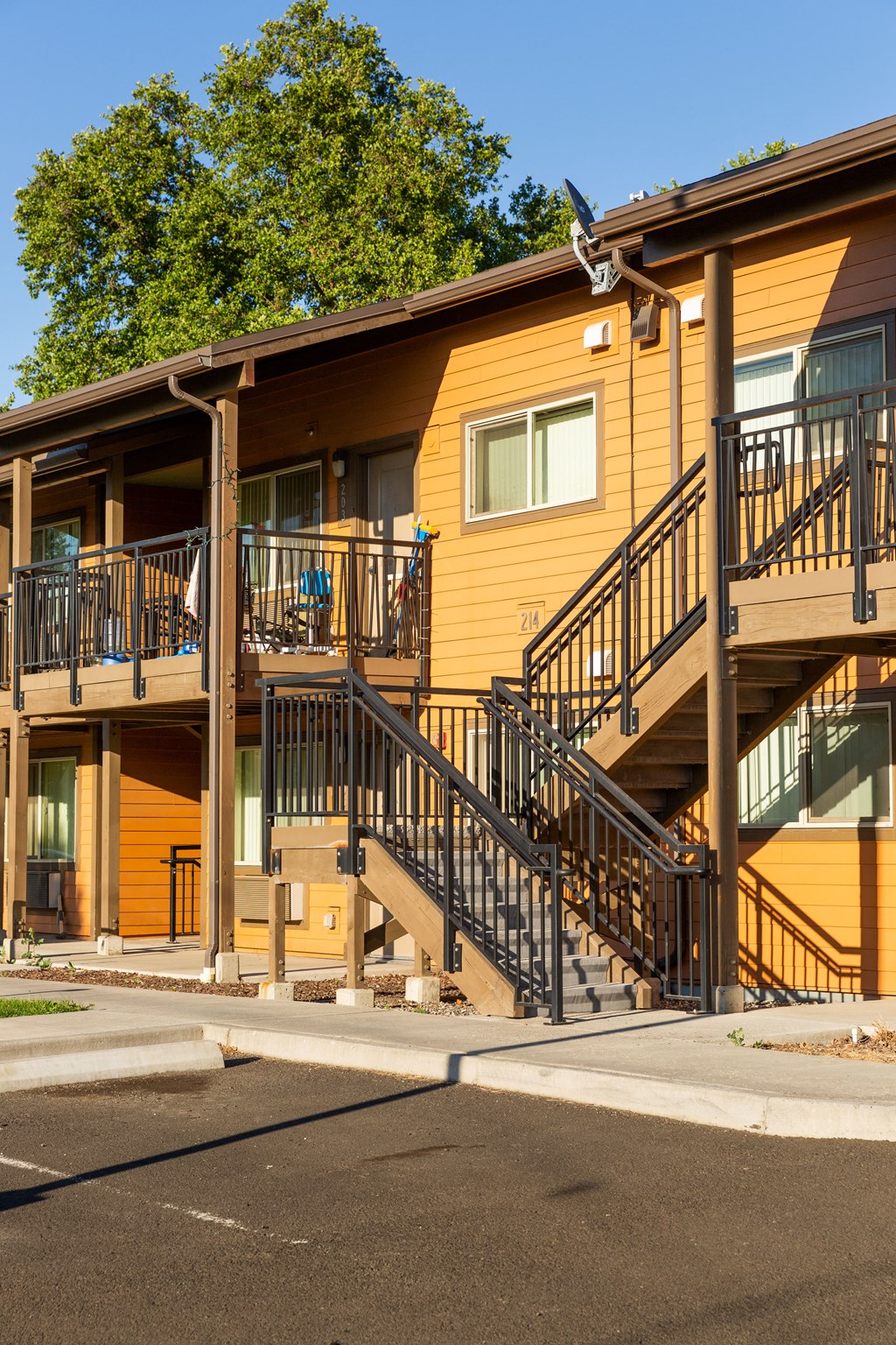the exterior of a building with stairs and balconies