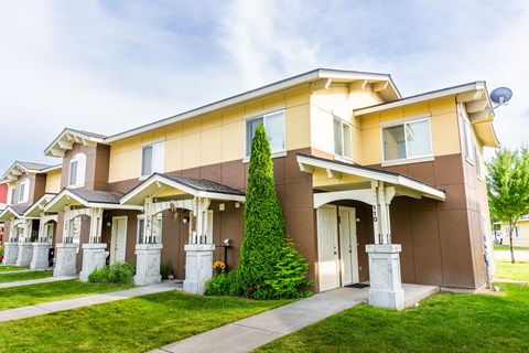 a house with a sidewalk in front of it