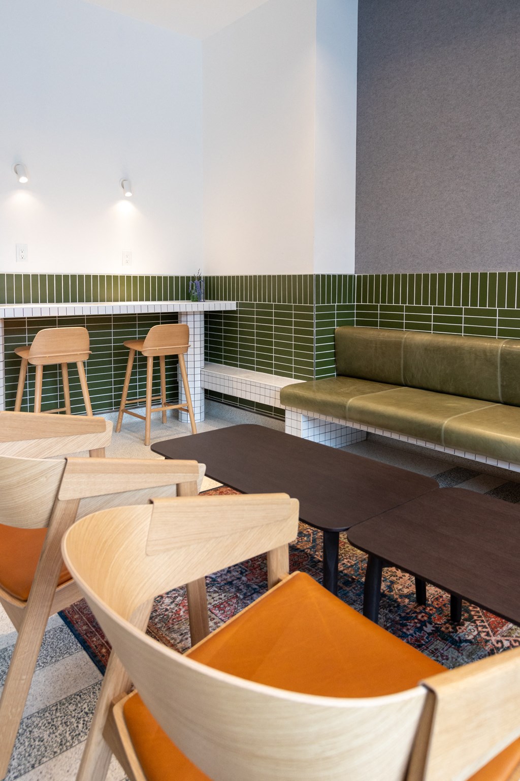 a group of wooden tables and chairs in a room