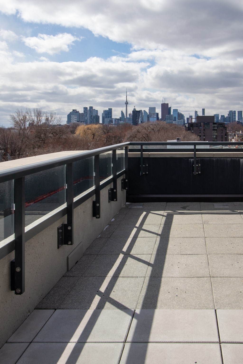 the view of the city from the top of a bridge