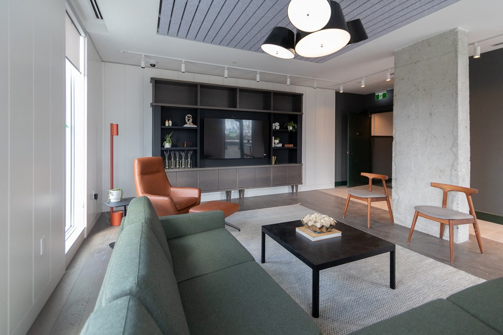 a living room with a couch and a coffee table and a television