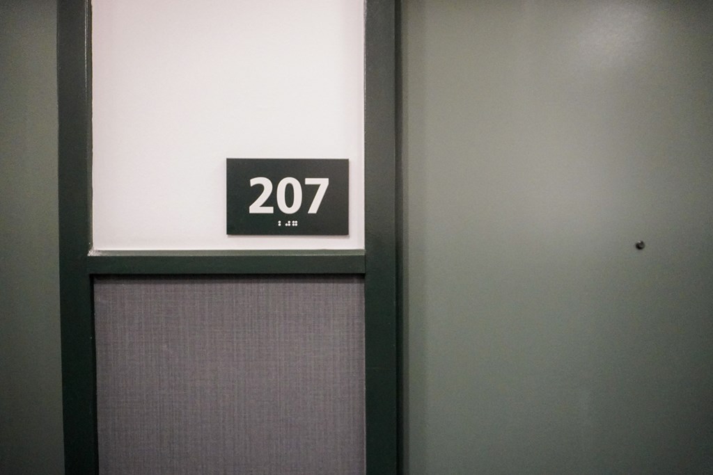 a door with a sign that says 207 on it