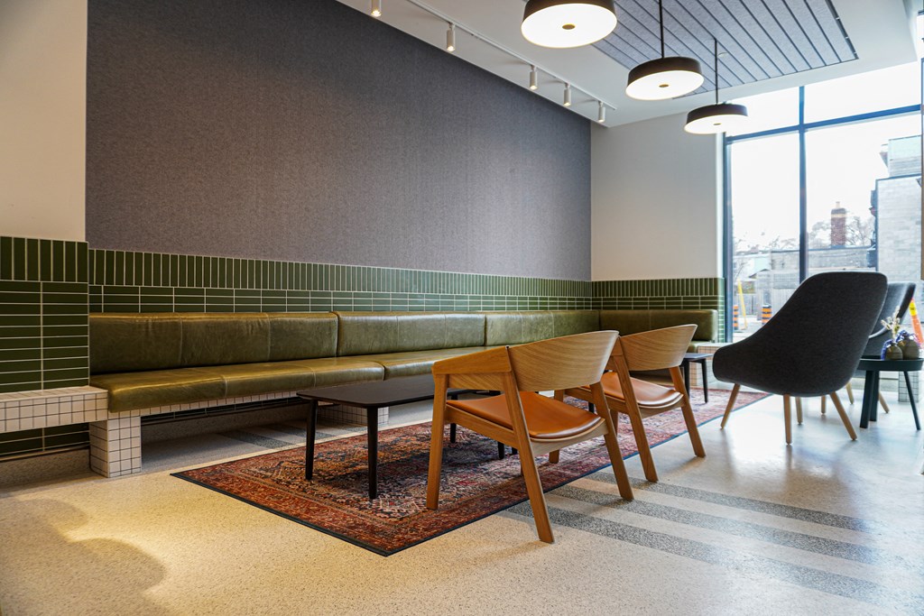 a seating area with chairs and a table in a lobby
