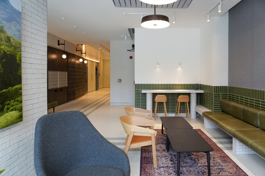 a living room with a table and chairs