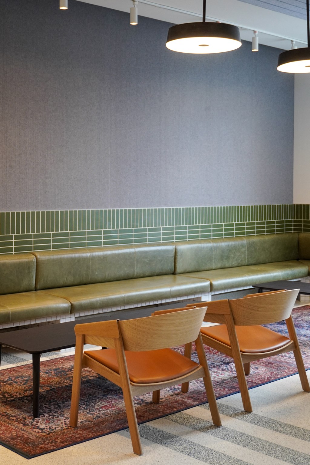 a table and chairs in a room with a couch