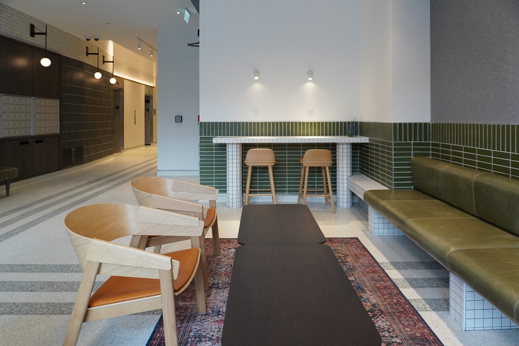 a living room with a table and chairs and a couch