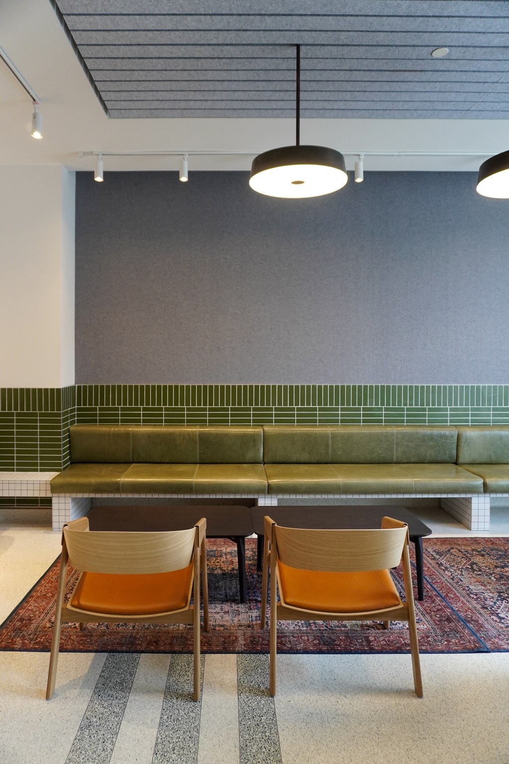 a lounge area with two chairs and a table