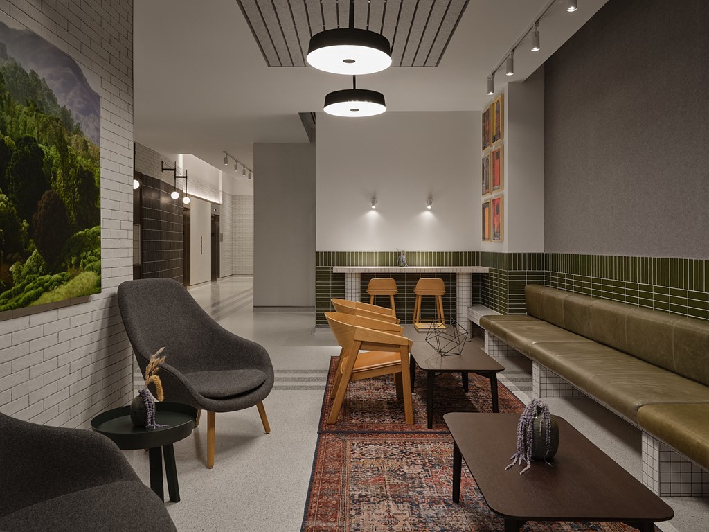 a living room with a couch and chairs and a table