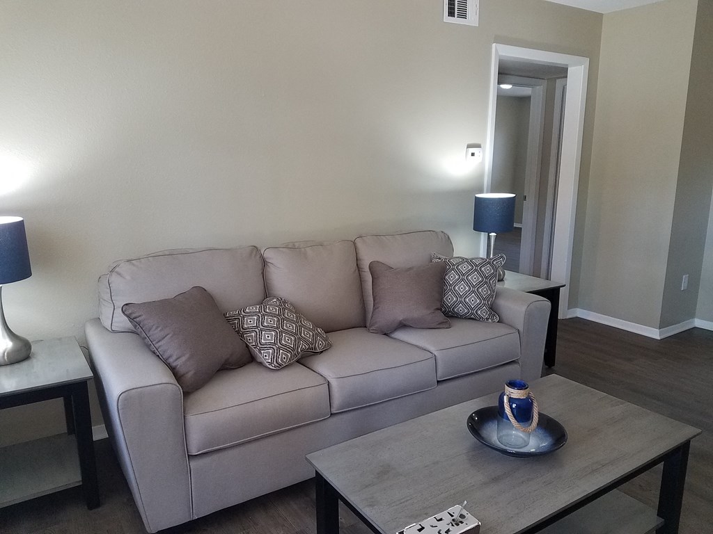 a living room with a couch and a coffee table