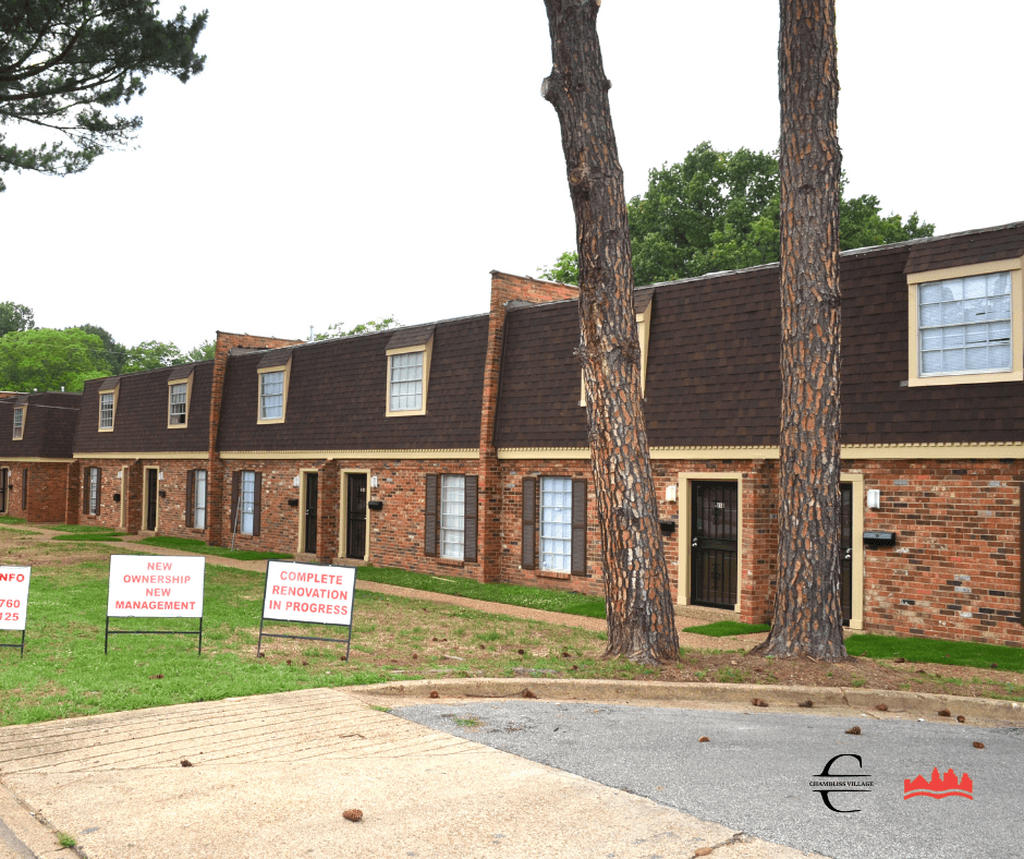 a row of houses with foreclosure signs in front of them