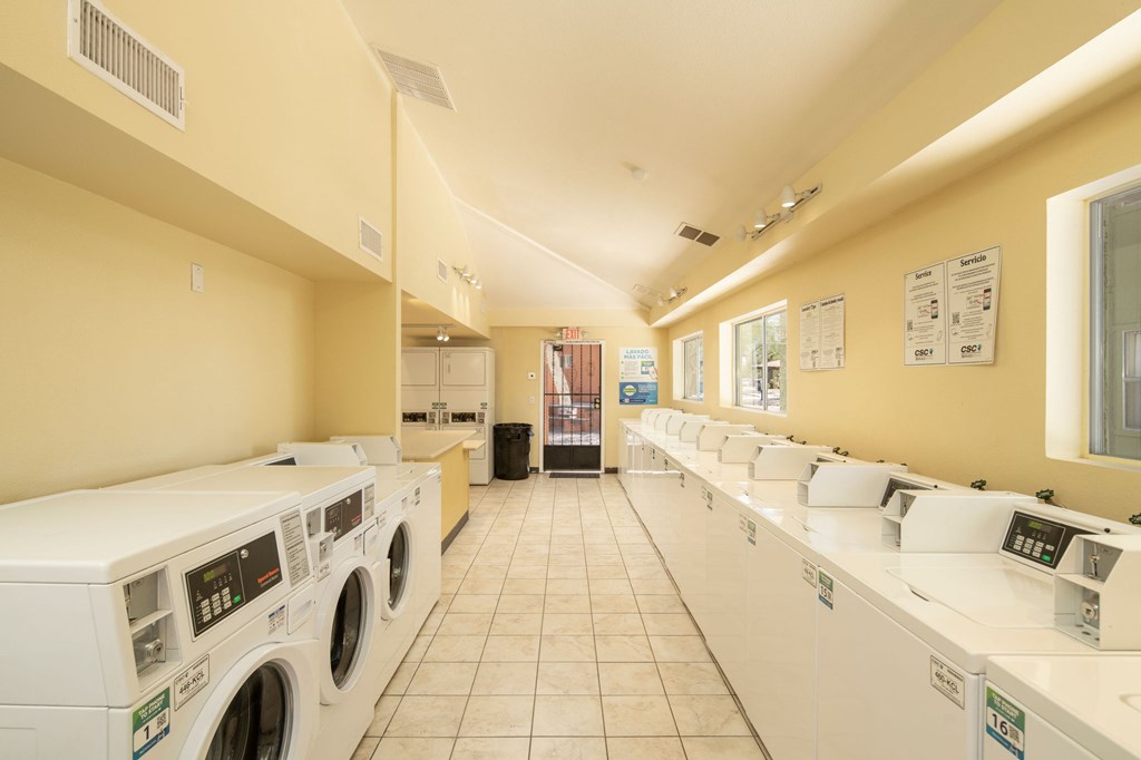 A row of washing machines in a public laundromat.