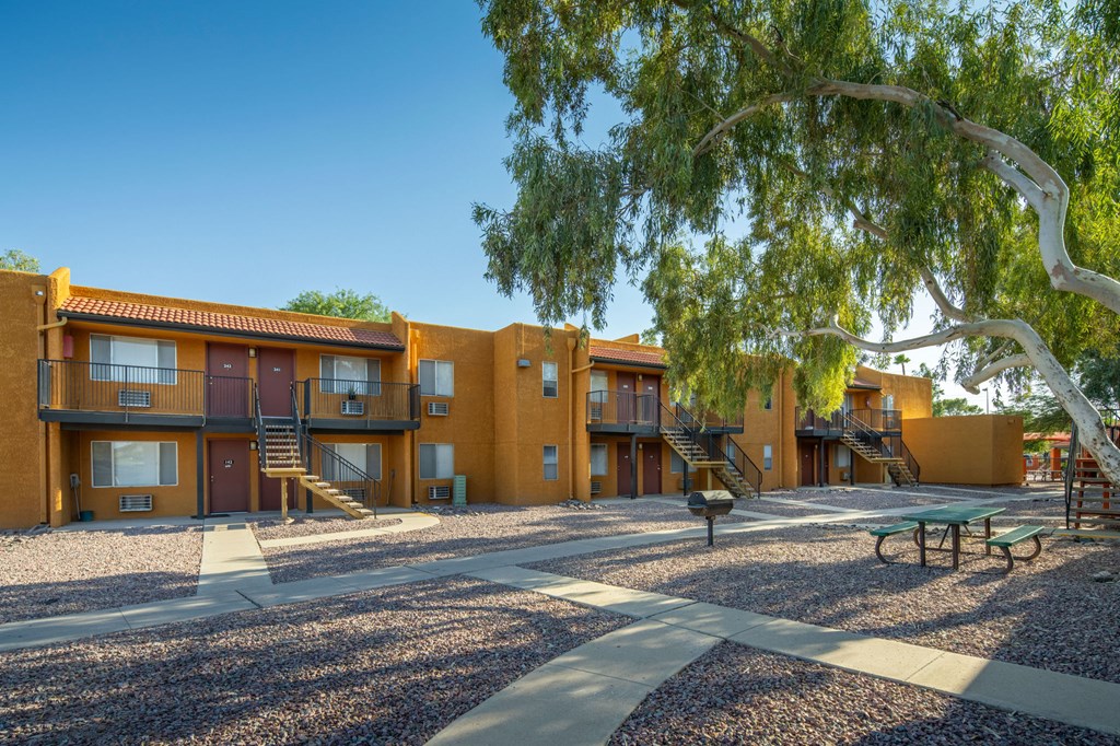 Apartment complex with a playground in front.