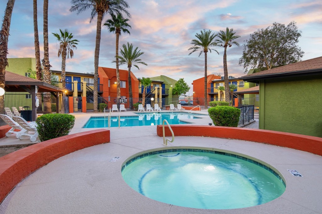 A round pool with a hot tub in the middle of it.