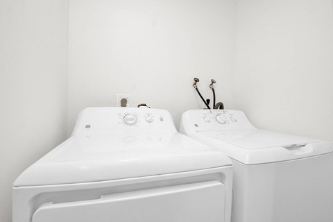 the laundry room has two washes and a dryer