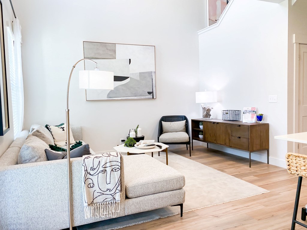 living space with windows and high ceilings