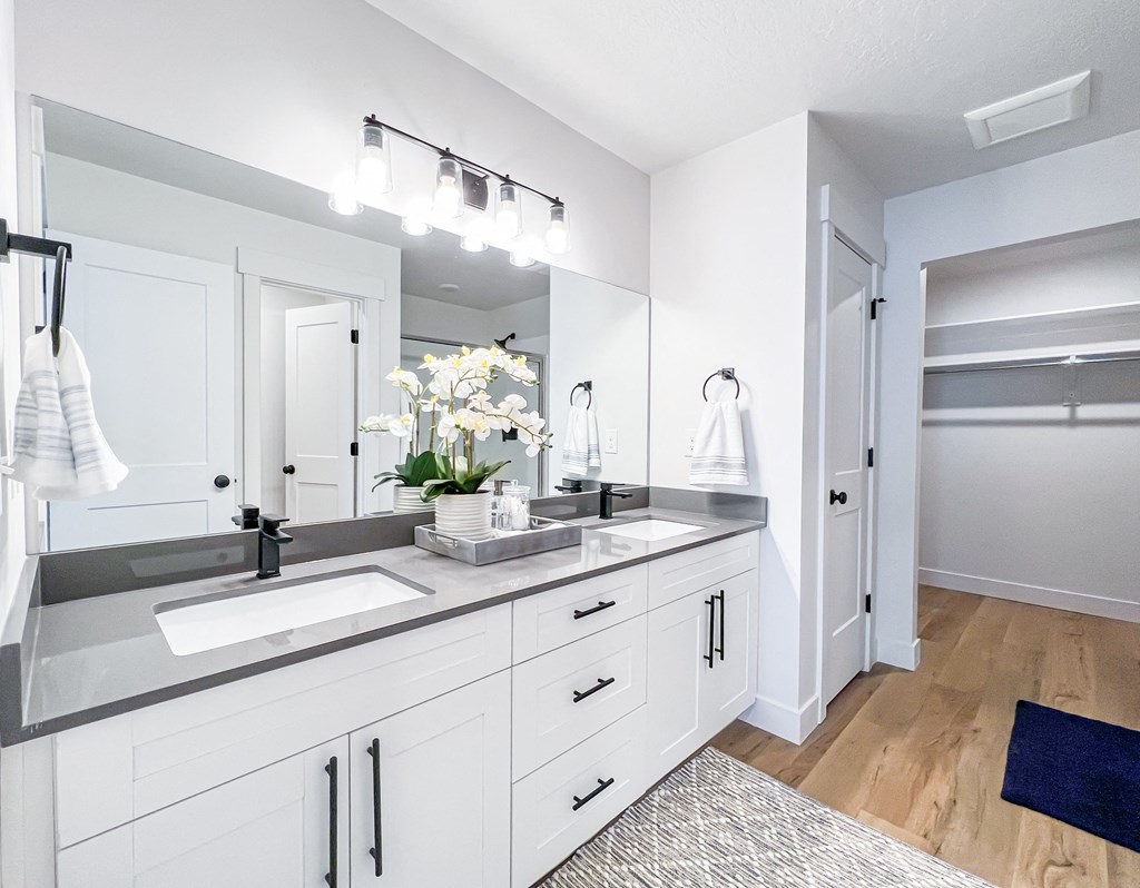 master suite bathroom with double vanity sinks