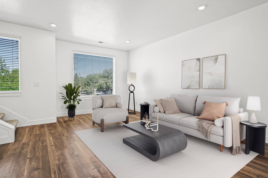 a living room with a couch and a chair at Aero Luxury Townhomes in Layton, UT