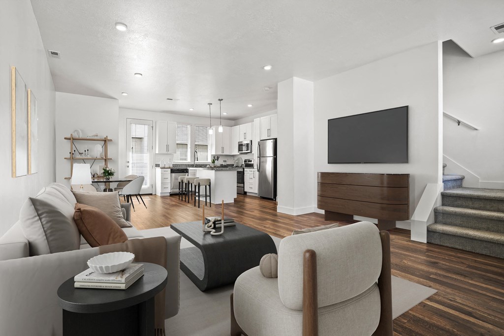 a living room with a couch and a table  at Aero Luxury Townhomes in Layton, Utah